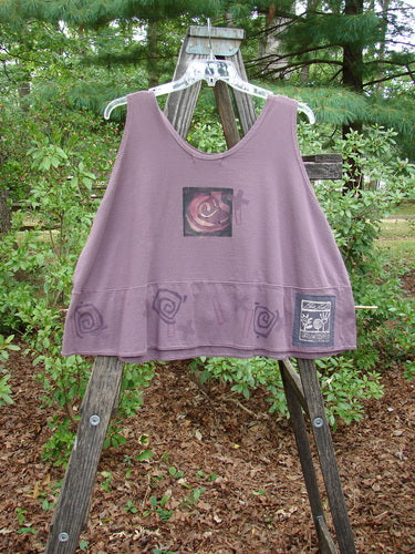 1995 Klee Button Top Salvador Heliotrope Size 2 displayed on a wooden rack, highlighting its playful A-line crop shape, scooped neckline, and distinctive ceramic button accent.