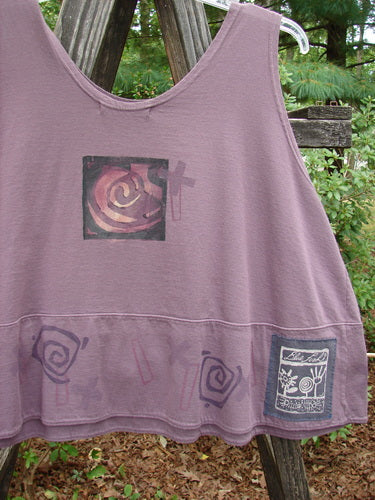 1995 Klee Button Top Salvador Heliotrope Size 2 featuring a swingy A-line crop shape, scooped neckline, and hand-stamped ceramic button on pocket. Signature Blue Fish patch and unique slanted room theme design.