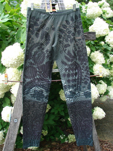Daisy Hagey Barclay NWT Cotton Lycra Heavy Weight Legging Night Spin Boreal Size 1 in dark green and black cotton lycra, shown hanging outdoors against white flowers.