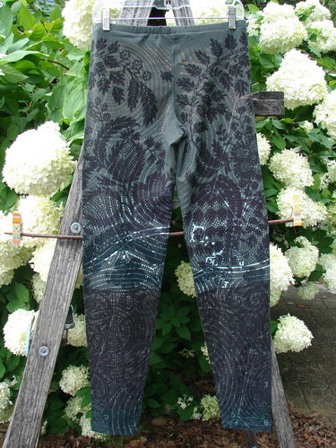 Daisy Hagey Barclay NWT Cotton Lycra Heavy Weight Legging Night Spin Boreal Size 1 in dark boreal blue and black cotton lycra, shown hanging on a wooden ladder beside white flowers and greenery.