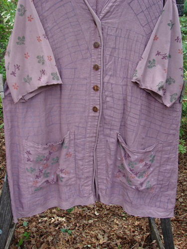Barclay Linen Cotton Sleeve Pocket Cardigan in Rich Mauve, featuring wooden button, V-neckline, drop shoulders with floral sleeves, and lower squared pockets.