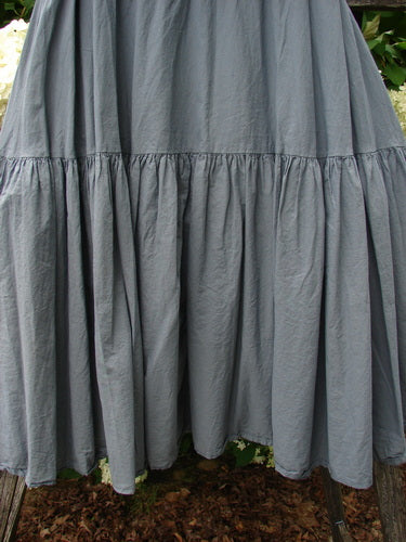 Bluefishfinder.com Barclay Linen Fold Over Single Tier Trinity Skirt in unpainted diatom, size 0, shown in a full-length view with a soft gray linen-like drape, a folded-over waistband, and a single gathered tier that creates a wide, gently flared silhouette.