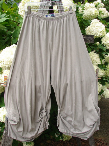 Bluefishfinder.com Barclay Crop Tie Bottom Crop 4 Square Pant in unpainted sand cloud, size 0, with a loose cropped silhouette, gathered elastic waist, and tie hems. The soft drapey fabric falls in wide folds, shown in a muted gray-beige tone.