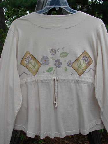 1999 Coffee Top Flowerpot Tea Dye Floral Size 2: White organic cotton shirt with a sweeping rounded hemline and a sweet floral painted design. Features a drawcord back and A-line crop.