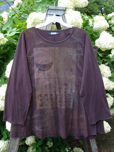 Bluefishfinder.com Barclay Long Sleeved Studio Cafe Tee in Celestial Purple Plum, size 2, shown as a loose long-sleeved top with a round neckline and sheer layered front panel. The plum fabric has a soft, semi-transparent finish and subtle tonal graphic detailing.
