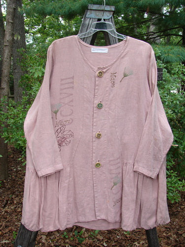 1998 Botanicals Meadow Jacket Macro Mallow Size 1, featuring five textured ceramic buttons, wide A-line shape, bottom flounce, scooped neckline, and botanical theme paint, displayed on an outdoor swinger.