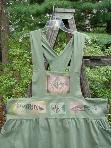 1995 Overall Jumper Fish Path Dinette Green OSFA featuring crisscross back straps, a wide skirt, oversized side pockets, and a fish design on the bib.