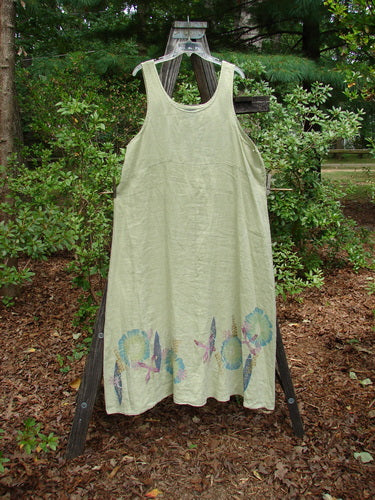 Barclay Linen Tank Dress Undersea Celery Size 2 on outdoor clothesline, featuring a rounded neckline, curved empire waist seam, sweeping lower skirt, painted undersea theme around hem.