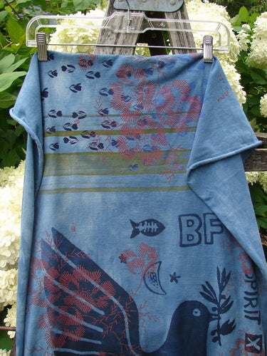 Bluefishfinder.com Barclay Scarf Wrap Belief Spirit Magic Love Dove Echo Blue OSFA in soft blue fabric, draped over a metal hanger with a folded side panel. The print layers coral-like florals, small fish, and bold graphic motifs in navy and red against the blue ground.