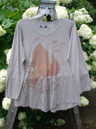 Bluefishfinder.com Barclay Modal Slub Long Sleeved A Lined Tee in peacock grey, size 0, with a soft slub texture, scoop neckline, and long sleeves. The A-line silhouette hangs loosely against a rustic hanger, with a faded bird graphic over the heathered knit.