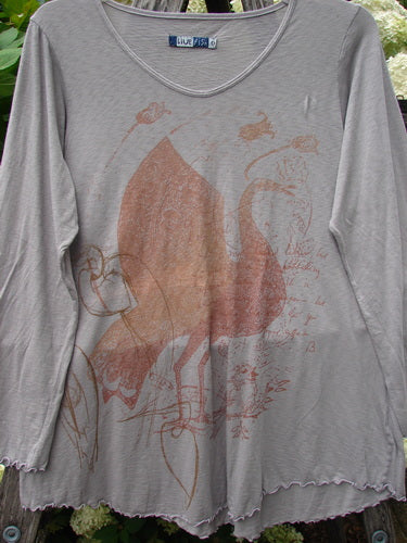 Bluefishfinder.com Barclay Modal Slub Long Sleeved A Lined Tee in peacock grey, a loose long-sleeve top with a soft slub texture, rounded neckline, and gently flared hem. The front shows a faded coral botanical print over the muted fabric.