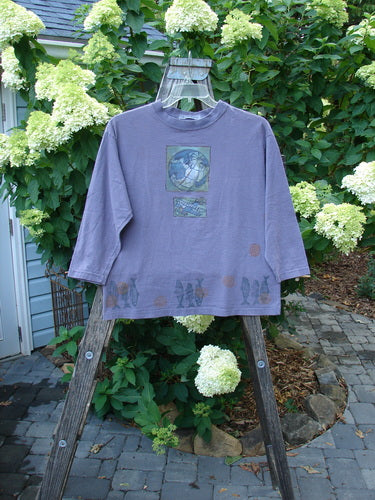 1996 Long Sleeved Tee Earth Sky Sea Mulberry Size 0 displayed on a wooden rack with a rounded ribbed neckline and boxy crop shape, emphasizing its perfect condition and distinctive design.