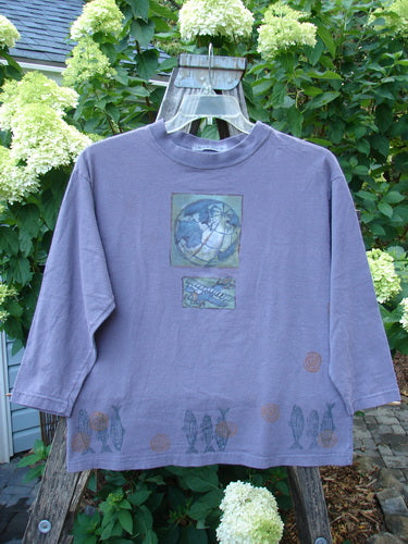 1996 Long Sleeved Tee Earth Sky Sea Mulberry Size 0 displayed on a hanger, featuring a rounded ribbed neckline and boxy crop shape with an Earth, Sky, and Sea theme design. 

