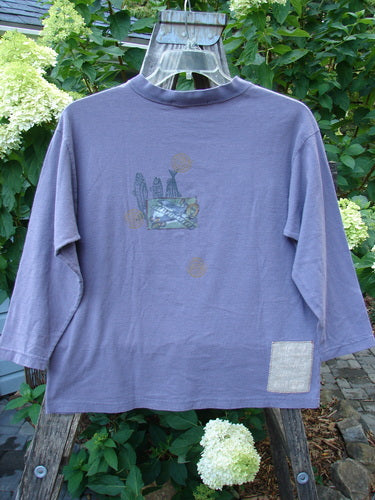 1996 Long Sleeved Tee Earth Sky Sea Mulberry Size 0 displayed on a hanger, showcasing its rounded ribbed neckline, boxy crop shape, and medium-weight organic cotton fabric.