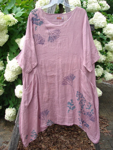 Bluefishfinder.com Barclay Linen Wave Pocket Dress Dried Sprig Tulsi Rose Size 1 in dusty rose linen, with a loose, airy silhouette, rounded neckline, and draped short sleeves. Blue botanical sprig prints scatter across the front and hem.