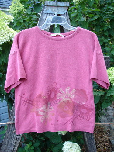 1997 Cotton Cashmere Crop Pullover with Wind Flower design and side alterations, showing stains on the pink fabric. Features include drop shoulders, ribbed hemline, and rolled neckline.