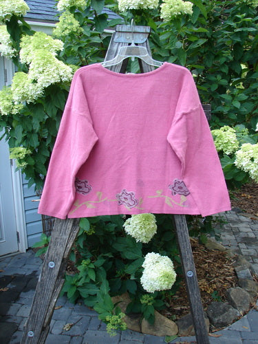 1997 Cotton Cashmere Long Sleeved Cardigan Stone Flower Geranium Altered OSFA displayed on a wooden rack, showcasing detailed stone flower theme paint and full front matching buttons.