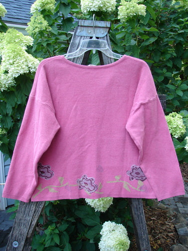 1997 Cotton Cashmere Long Sleeved Cardigan Stone Flower Geranium Altered OSFA displayed on a wooden hanger, highlighting its floral patterns, ribbed hemline, and buttoned front.