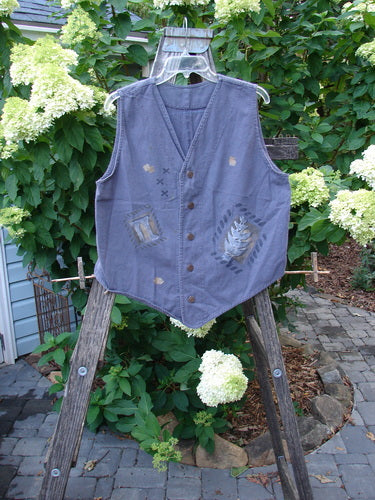 1995 Denim Invention Vest Fern Flower Madderlake Altered OSFA displayed on a wooden stand, showcasing metal buttons, varying hemline, and classic fern and flower paint details.