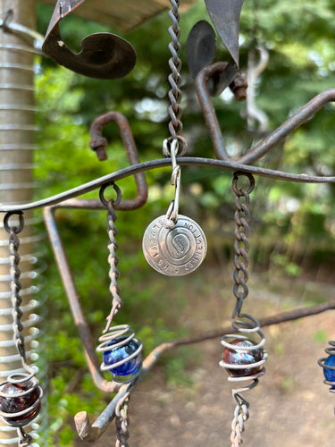 1995 Sterling Silver Twisty Charm Blue Fish Connection Pendant: Metal chain with a coin charm, featuring a blue ball with a white coil, exemplifying unique fashion accessories.