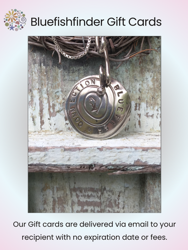 Bluefishfinder Gift Card from $25.00, depicted as a close-up image of a round metal key chain, symbolizing the freedom to choose vintage Blue Fish Clothing, aligning with the store's creative ethos.