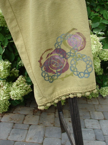 1999 Flannel PJ Pant with Pom Pom Rose Leaf design, featuring a towel on a chair and a pole, close-up of flowers, and a wooden post on a stone surface.