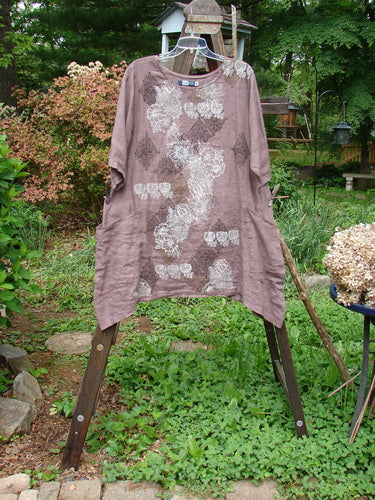 Image alt text: Barclay Linen Urchin Dress with continuous floral design, size 0, on a rack.