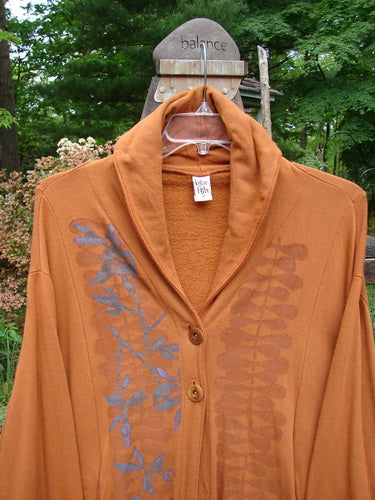 Barclay Fleece Two Button Jacket Vinery Gourd Size 1: A brown jacket with a blue design, dolman sleeves, and wooden-like buttons.