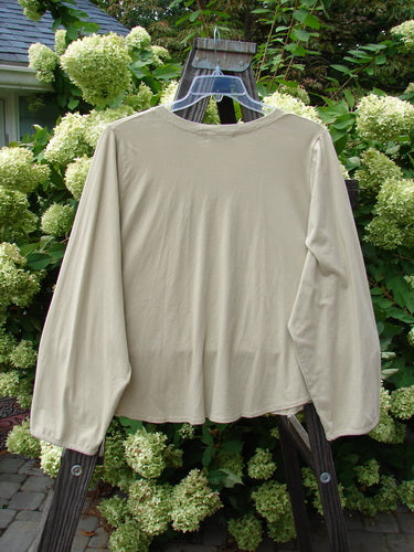 Image alt text: Barclay Round Hem V Neck Top on a swinger, mid-weight organic cotton, cropped length, unpainted.