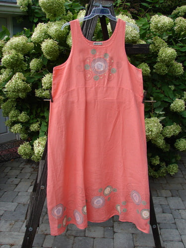 A Barclay Linen A Line Shift Dress in Tangerine, featuring a rounded neckline, empire waist seam, sweeping lower skirt, and not too deep arm openings. Size 2.
