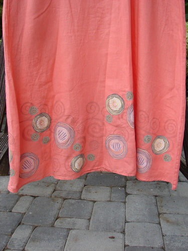 A Barclay Linen A Line Shift Dress in Tangerine with a patterned pink curtain in the background.
