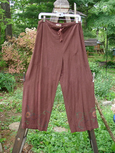 Barclay Tencel Collar Drawstring Studio Duo Spin Flower Sepia Size 1: A pair of pants on a clothesline, part of the Fall Collection.