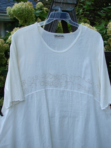 A white Barclay Linen Cotton Sleeve Banded Hem Pleat Dress with fern-themed paint and curved sewn panels. Size 2.