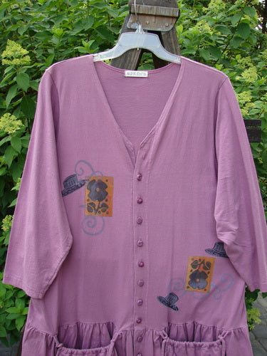 1997 Belladonna Jacket Tall Hat Geranium Size 1: A purple shirt with a hat and flowers on it, featuring a whimsical top hat theme paint.
