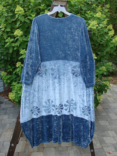1997 Velvet Aditi Dress, Wind Spin Peacock. Long flowing dress with belled weighted lower half. Deep side pockets. Sheer iridescent ribbon accents. Bust 52-54, Waist 52-54, Hips 62, Length 52.