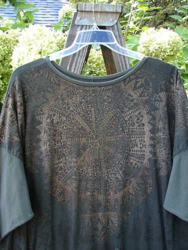 Barclay Bamboo Drop Pocket Dress Metallic Medallions Black Sand OSFA displayed on a hanger, featuring a boatneck, three-quarter sleeves, drop pockets, and metallic medallion art, embodying Bluefishfinder.com's vintage, expressive style.
