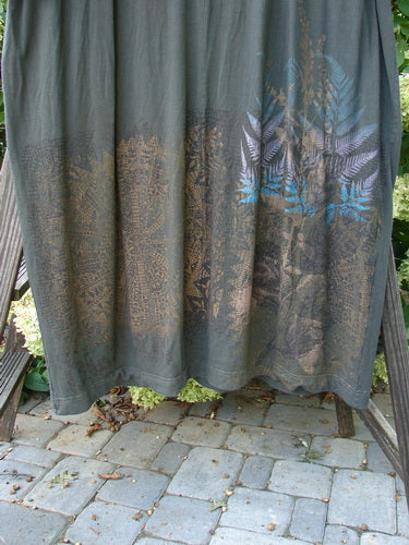 Barclay Bamboo Drop Pocket Dress Metallic Medallions Black Sand OSFA features a seamless front and back bodice with wide, contrasting three-quarter sleeves and dynamic metallic medallion art, emphasizing comfort and individuality.