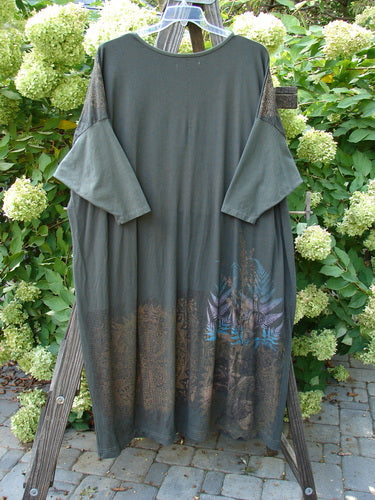 Barclay Bamboo Drop Pocket Dress Metallic Medallions Black Sand OSFA features a seamless bodice, wide three-quarter sleeves, and exterior pockets, showcasing a dynamic metallic medallion design in organic cotton and bamboo blend.