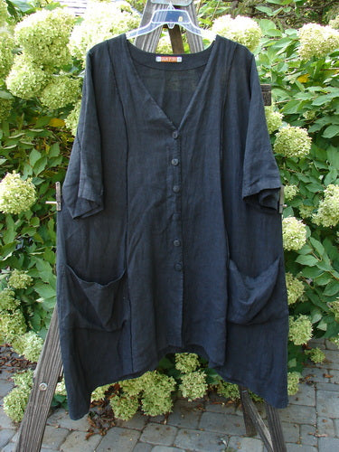 Image alt text: Barclay Linen Double Tie Back Jacket, black dress on a rack, medium weight linen, deep V neckline, A-line sweep, front drop flop pockets, varying hemline, size 1