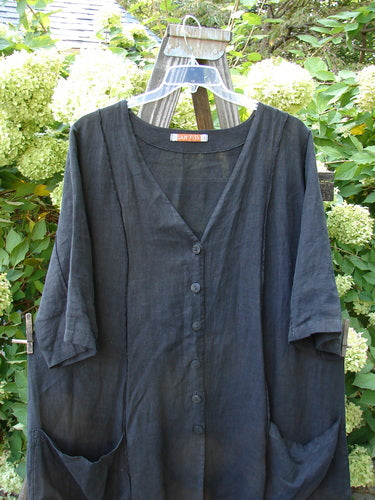 Image alt text: Barclay Linen Double Tie Back Jacket, black shirt on a swinger, deep V neckline, A-line sweep, front drop flop pockets, varying hemline, size 1