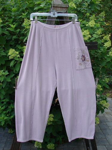 Barclay Thermal Single Pocket Pant in Mallow, Size 1. Medium weight cotton pant with elastic waistline, tapered shape, and longer inseam. Features painted exterior pocket accent and vertical stitchery. Cozy and stylish.