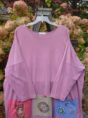 1997 Collage Top Petal Power Crocus OSFA: A long-sleeved shirt with patchwork designs on a swinger. Made from mid-weight organic cotton. Features drop shoulders, vented sides, and oversized front pockets with vintage knot buttons.
