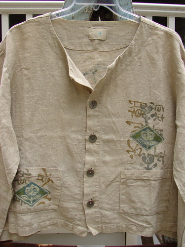 1999 Summercloth Hemp Crop Jacket Nature Cement Size 1: A close-up of a shirt with a nature-inspired design, metal button front, and drop shoulders.