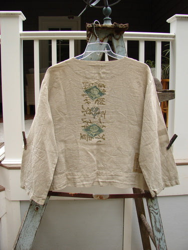 1999 Summercloth Hemp Crop Jacket Nature Cement Size 1: A shirt on a swinger, featuring a boxy and vented crop length, metal button front, drop shoulders, and detailed nature-inspired paint.
