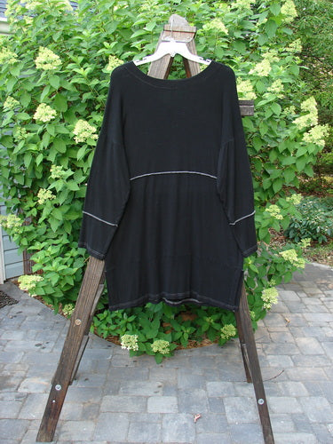 Image alt text: "Barclay Rayon Lycra Snap Reverse Stitch Contrast Cardigan, black shirt on a clothes rack"