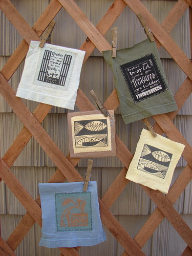 A set of fabric squares on a wooden lattice, featuring the PMU Mixed Signature Patch Set Total 5 in Green Lake, White, Peacock, Citron, and Riverbed. Purchase mounted or patches only.