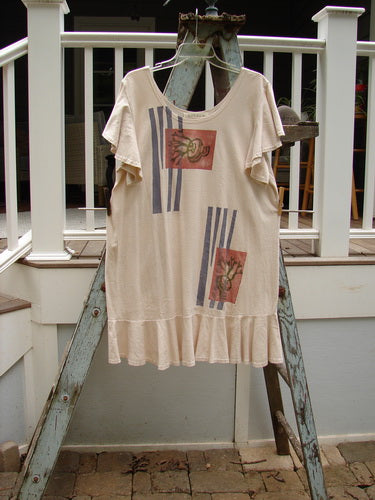1996 Butterfly Dress Garden Path Birch Bark Size 1: A shirt on a ladder, a white t-shirt with red and blue designs, a shirt on a swinger, a white towel on a ladder, a close up of a brick.