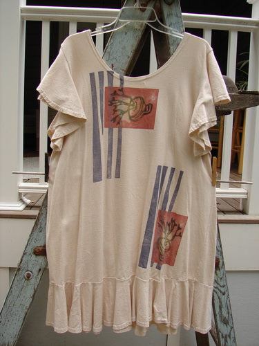 A 1996 Butterfly Dress with a garden path theme in birch bark. Features ruffled sleeves, a lower ruffled hem flounce, and a deep rounded neckline. Made from light organic cotton. Size 1.