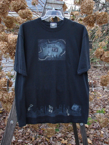 2000 Short Sleeved Tee Austin Texas Black Size 1: A black t-shirt with a graphic design of Austin Texas theme paint and a Blue Fish patch.