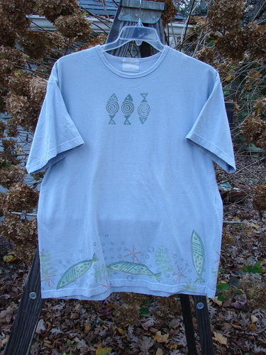 1999 Short Sleeved Tee Fish Triple Water Size 1: A t-shirt with fish designs in water. Organic cotton jersey. Rolled neckline. Straight shape. Super Fish Triple theme paint. Blue Fish patch. Bust 48, Waist 48, Hips 48. Length 30 inches.